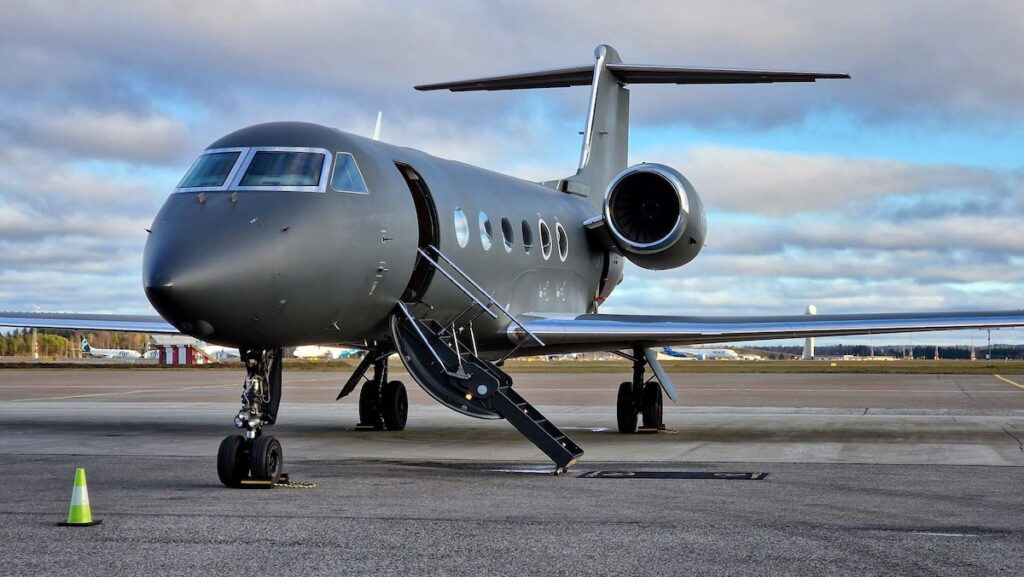 Dark grey private jet parked at Oslo airport